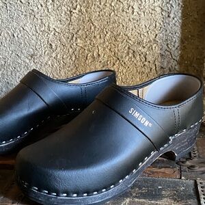 Simson Black Leather Clogs